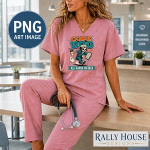 May include: A dusty rose scrub set featuring a V-neck top and matching pants. The top displays a graphic of a skeleton nurse holding a coffee cup and clipboard with the text CODE BOO and ALL HANDS ON DECK. A stethoscope is held in the hand.