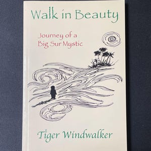 May include: A book titled "Walk in Beauty" with the subtitle "Journey of a Big Sur Mystic" and the author's name, Tiger Windwalker. The cover features a black and white illustration of a person standing on a shoreline with stylized waves and palm trees.