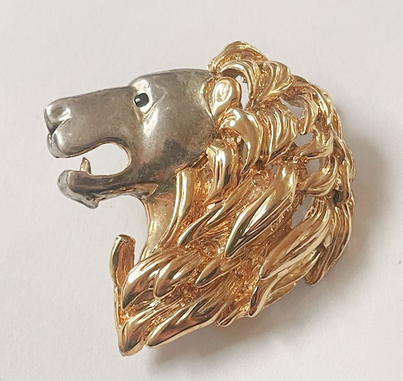 Lion head brooch discount