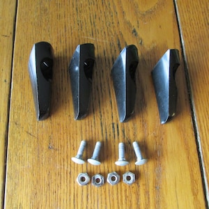 May include: Four black plastic corner protectors with four silver screws and nuts.