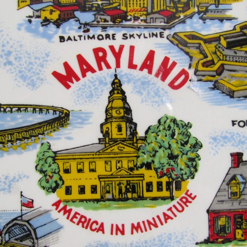May include: A vintage souvenir plate featuring a colorful illustration of the Baltimore skyline, the Maryland State House, and the text "Maryland, America in Miniature".