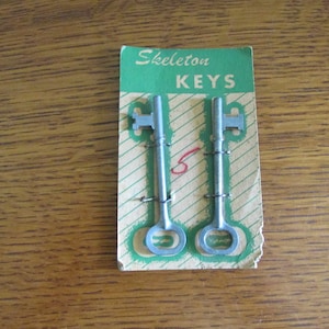 Vintage Pair Skelton Keys Unused