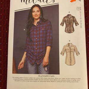 May include: A sewing pattern for a shirt with multiple views. The pattern includes simple instructions and a hashtag #LynneMcCalls. The pattern is designed and printed in the USA.