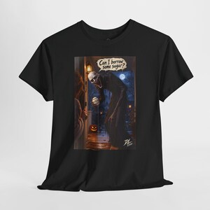 May include: A black short-sleeve t-shirt featuring a graphic print of a tall, skeletal figure standing at a doorway at night. The figure holds a small container and a speech bubble above its head contains the text, Can I borrow some sugar?