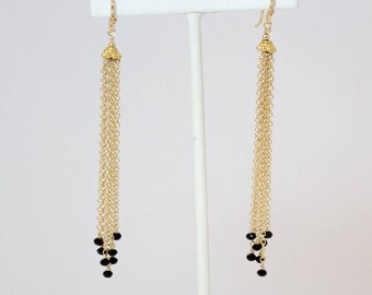 Black spinel gold tassel earrings on gold filled chain and ear wires.    3 1/2 inches from top of ear wire to bottom of longest strand.