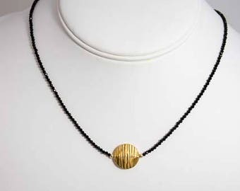 Black spinel choker with textured vermeil disc.  Shown in 16 1/2 inches.  Choose your own length.