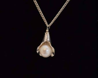 Beautiful pearl and sterling silver leaf pendant on sterling silver chain.  Pearl necklace.  Chain is 17", with pendant ~19 1/2".