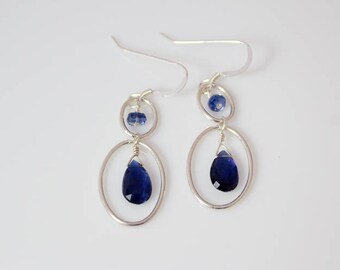 Kyanite with sterling silver ovals on silver ear wires.    ~1 5/8 inches.