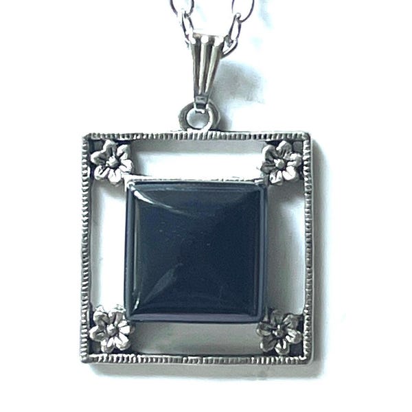 Add classic sophistication to your collection with this vintage  silver necklace. The square black onyx pendant is beautifully frame