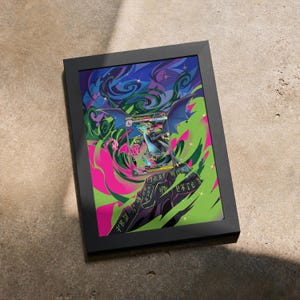 May include: A framed rectangular print featuring a central trading card illustration of a winged dragon creature. The artwork displays vibrant swirls of green, pink, and blue, with a dark stone-like pedestal inscribed with symbols at the bottom.