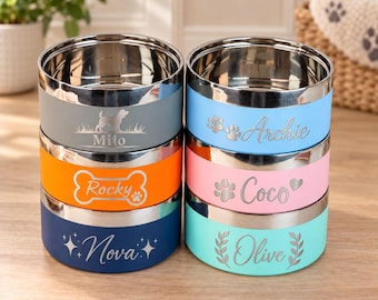 May include: Six stainless steel pet bowls with colored exteriors. The gray bowl features the name Milo, the orange bowl features Rocky in a bone shape, the blue bowl features Nova, the light blue bowl features Archie, the pink bowl features Coco, and the teal bowl features Olive.