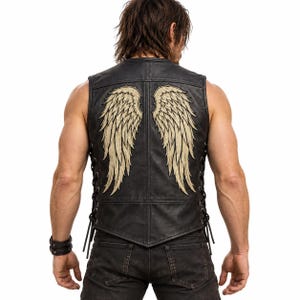 May include: A black leather vest featuring large, embroidered beige angel wings on the back. The vest has side lacing with black cords and a pointed hemline. The design is symmetrical, with one wing on each side of the center back seam.