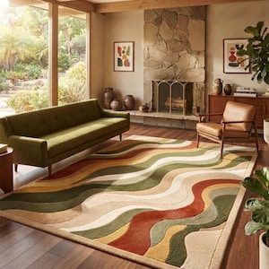 May include: A rectangular area rug featuring a wavy, multi-colored pattern of olive green, burnt orange, cream, and tan stripes. The rug has a textured, tufted surface with distinct color-blocked sections that create a flowing, organic design.