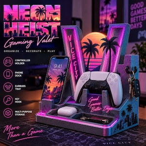 May include: A gray gaming valet stand featuring neon pink and blue lighting, a phone dock, a controller holder, an earbud tray, and a key hook. The stand displays the text NEON HEIST, VICE CITY, and Good Games Better Days with palm tree silhouettes.
