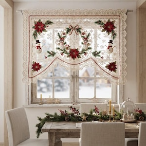 May include: A cream-colored lace window valance featuring a scalloped edge and a central wreath design. The fabric is decorated with embroidered red poinsettias, green pine branches, and small snowman figures, all accented with a red trim border.