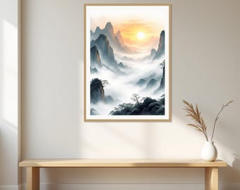 May include: A framed wall art print depicting a mountain landscape with jagged peaks rising above a thick layer of white mist. The scene features a bright golden sun glowing in the sky, with dark silhouettes of trees in the foreground.