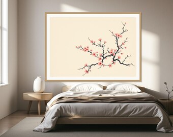 May include: A rectangular wall art print featuring a dark, gnarled branch with delicate pink cherry blossoms against a solid cream-coloured background, enclosed in a simple light wood frame, displayed horizontally above a bed.