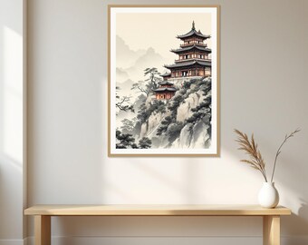 Op de afbeelding: Een ingelijste kunstdruk met een pagode met meerdere verdiepingen op een rotsachtige klif. De scène bevat bergen in inktwasstijl, dennenbomen en zachte beigetinten, gepresenteerd in een lichthouten lijst aan een effen muur.