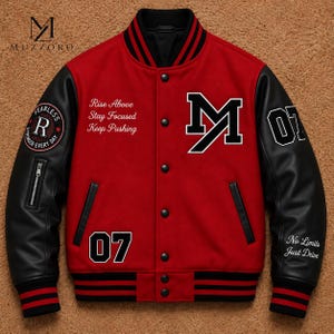 May include: A red and black varsity jacket featuring black leather sleeves, a snap-button front, and striped ribbed trim. The chest displays the letter M, the text Rise Above Stay Focused Keep Pushing, and the number 07. Patches include Fearless R.