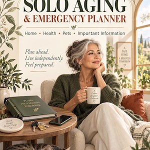 May include: A Solo Aging & Emergency Planner binder with a dark green cover, featuring the text Plans for a Brighter Tomorrow. The planner sits on a wooden table next to a white coaster with text, keys, and a smartphone, with a cat resting nearby.