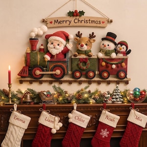 May include: A crocheted wall hanging featuring a train with Santa, a reindeer, a snowman, and a penguin in the carriages. Above the train is a wooden sign that reads Merry Christmas. Below are five hanging stockings labeled Emma, Liam, Chloe, Noah, and Mia.