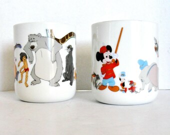 Pair of Walt Disney Mugs Mickey Mouse Parade and Disney Jungle Book themed. Fine Porcelain Disney Collectibles