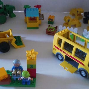 LEGO DUPLO Building Set.  Vintage  Bricks that includes bricks and vehicles from Lego Bus Station and Lego Farm.