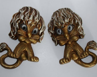 Mid Century Modern Wall Decor Two Lion Plaques in Gold with White Highlights Universal Statuary Corp Chicago, IL circa 1970