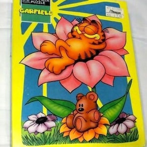 1978 年製の愛らしいガーフィールドのパズル。猫のガーフィールドとテディベアのビンテージ 100 ピース パズル。