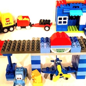 Large Lego Duplo Set Skippers Flying School, Road Repair Equipment, Fire House, Truck, and a Home. Hours of play and learning skills.