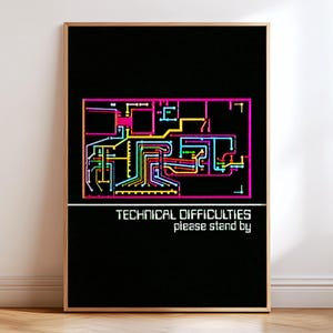 May include: A framed rectangular wall art piece with a black background. The top section features a colourful circuit board graphic in pink, yellow, blue, and green. Below, white text reads: TECHNICAL DIFFICULTIES, followed by please stand by.