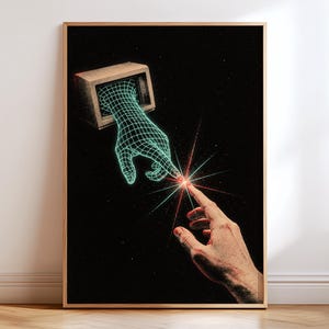 May include: A framed wall art print featuring a black background with a wireframe hand emerging from a vintage computer monitor, reaching toward a realistic human hand. A bright red and green starburst light effect connects the two fingertips.