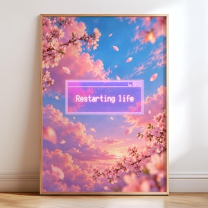 May include: A framed vertical wall art print featuring a vibrant sunset sky with pink and orange clouds, cherry blossom branches in the foreground, and a central neon-style rectangular window graphic containing the white text Restarting life.