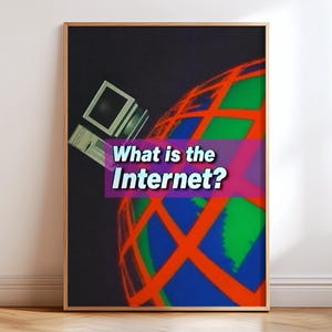 May include: A framed wall art print featuring a black background with a stylised globe in blue, green, and orange grid lines. A vintage computer monitor sits to the left. The text "What is the Internet?" appears in white on a purple bar.