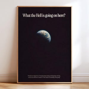 May include: A framed rectangular wall art print featuring a black background with a partial view of the Earth. The text at the top reads "What the Hell is going on here?" and smaller text at the bottom reads "Nobody has it figured out."