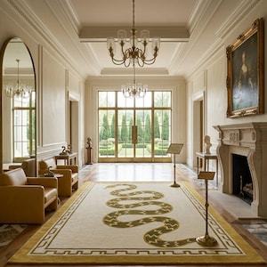 May include: A large rectangular area rug featuring a central olive green snake motif with a zigzag pattern on a cream background, framed by a mustard yellow border with a geometric Greek key design, centred in a grand hallway with a fireplace.