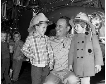 Friendly Fireman gives Tour Vintage Photo: Kids Wear Fire Helmets on Visit to Fire Station 1968