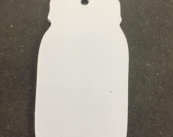 May include: White mason jar shaped ornament with a hole at the top for hanging.