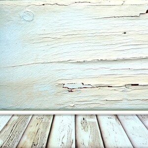 May include: A whitewashed wood background with a distressed, weathered look. The wood has a light blue tint and shows signs of cracking and peeling paint. The bottom of the image shows a wood floor with a similar distressed look.