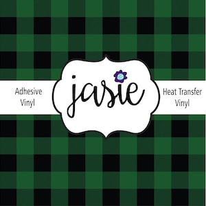 May include: Green and black plaid pattern with the word "jasie" in a white, decorative frame. The text "Adhesive Vinyl" and "Heat Transfer Vinyl" are also present.