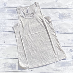 May include: A gray tank top with a scoop neck and a gathered detail at the back.