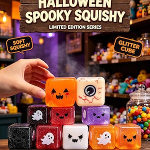 May include: A collection of Halloween-themed squishy cubes featuring various designs including ghosts, jack-o'-lanterns, and eyeballs. The cubes are made of soft, glittery material in colors like orange, purple, black, red, and white, with spooky faces.