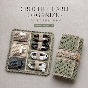 May include: A crochet cable organizer pattern PDF digital download featuring a rectangular mat with pockets and elastic loops holding various white and black charging cables and power adapters, alongside a rolled-up matching green crochet case.