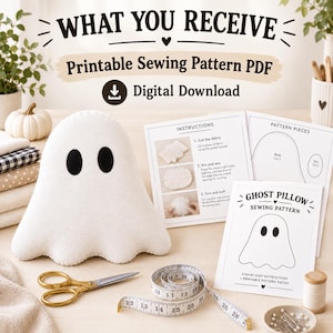 May include: A white ghost-shaped plush pillow with black oval eyes, accompanied by printed sewing pattern instructions, a gold pair of scissors, and a white measuring tape showing numbers up to 66 cm, labelled as a printable PDF digital download.