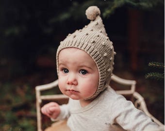 Hand knitted baby pixie bonnet for 0-12 months baby.Baby pixie hat. Popcorn newborn pixie bonnet. Bobble hat.Made to  order.