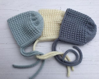 Baby bonnet with ties for a boy. Hand knitted Baby hat in shades of blue. Gender neutral baby bonnet in merino wool.