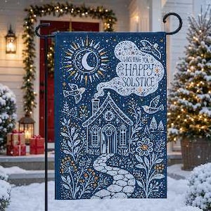 May include: A rectangular garden flag featuring a dark blue background with white and gold illustrations of a cottage, a stone path, flowers, birds, and a crescent moon. The text reads WISHING YOU A HAPPY SOLSTICE in a decorative script.