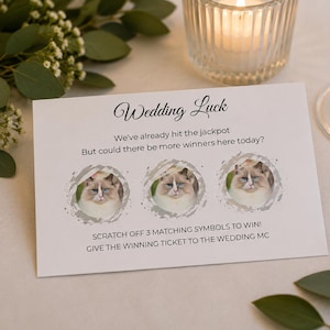 Może przedstawiać: Biała prostokątna zdrapka ślubna z tekstem Wedding Luck, We've already hit the jackpot, But could there be more winners here today?, oraz SCRATCH OFF 3 MATCHING SYMBOLS TO WIN! GIVE THE WINNING TICKET TO THE WEDDING MC.