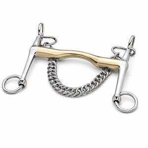 May include: A silver-coloured metal horse bit featuring a curved gold-coloured mouthpiece and a silver curb chain. The bit includes two side shanks with rings at the top and bottom, designed for equestrian use with a bridle and reins.