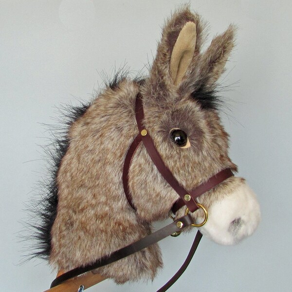 Child's Hobby horse (stick horse) Donkey. Top quality plush fur fabric with hardwood pole, wheels and leather bridle with bell. Ages 1-4